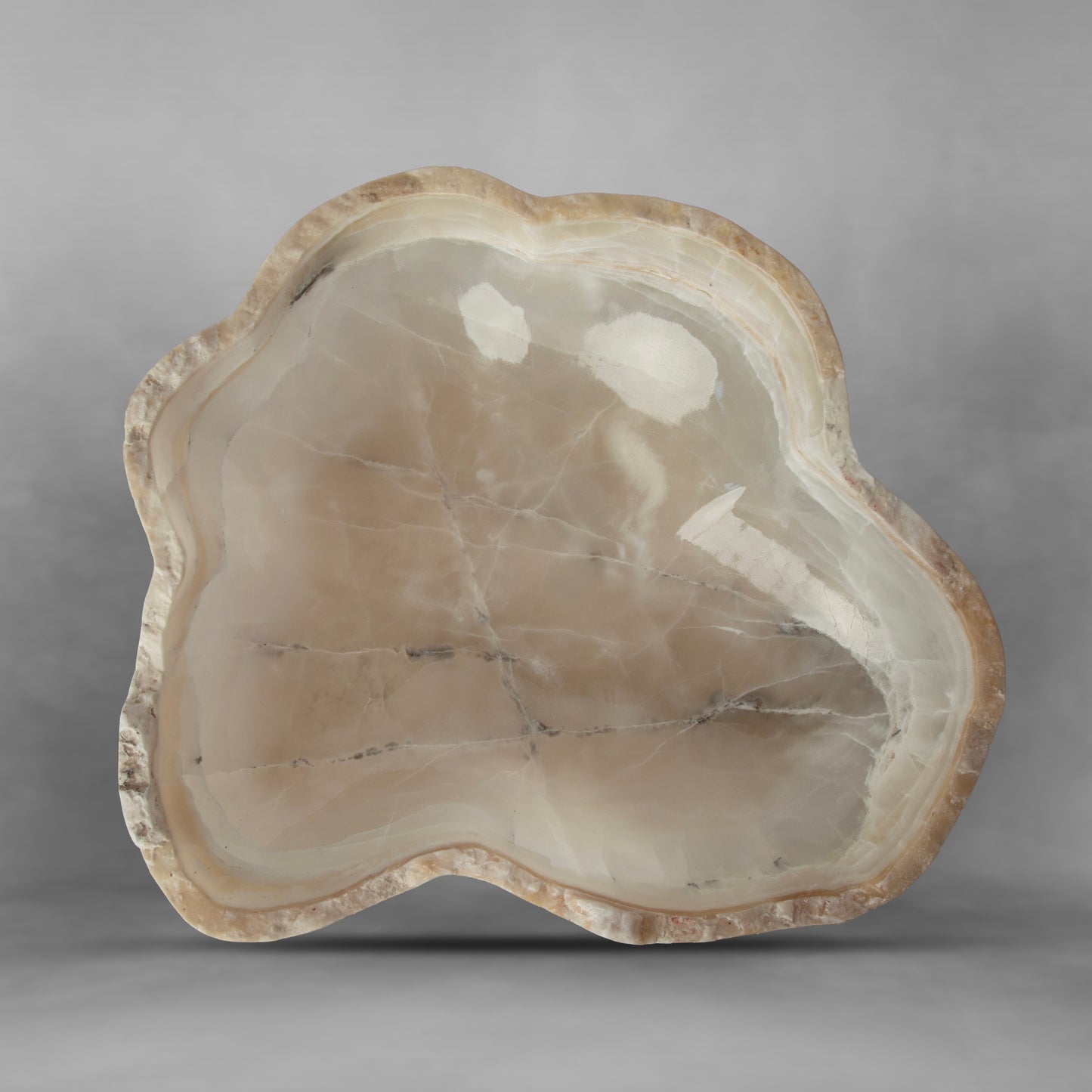 White & Pearl Series 47, white and light brown in an irregular bowl in onyx