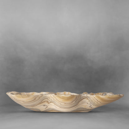 Light colored butterfly with texture, two design patterns in white and yellow, onyx bowl