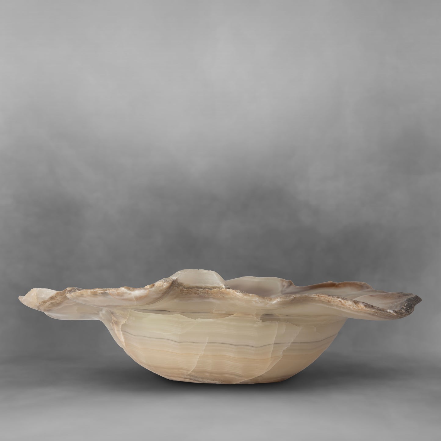 Beautiful and elegant with irregular shapes forming a pearl bowl in onyx