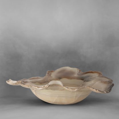 Beautiful and elegant with irregular shapes forming a pearl bowl in onyx