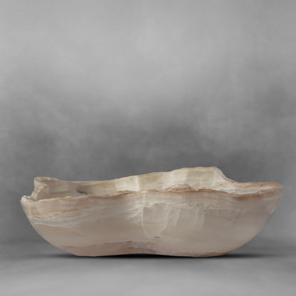 White & Pearl Series 47, white and light brown in an irregular bowl in onyx
