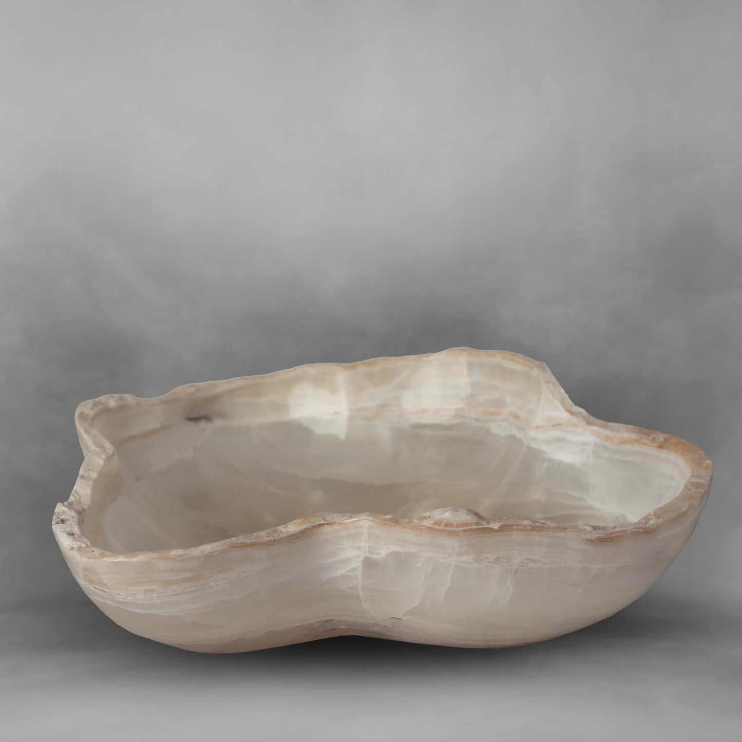 White & Pearl Series 47, white and light brown in an irregular bowl in onyx